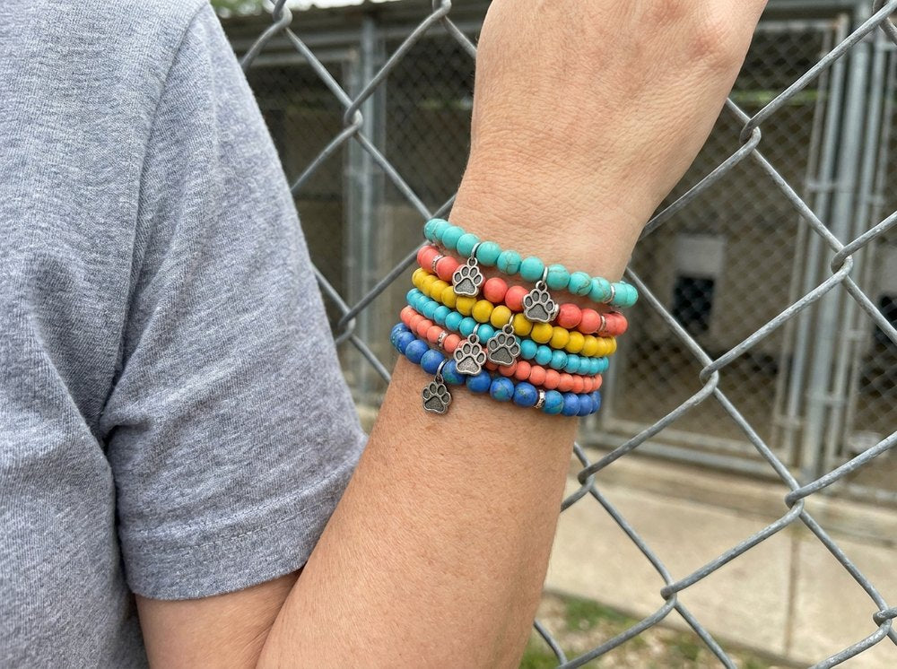 Beaded paw bracelets on a wrist